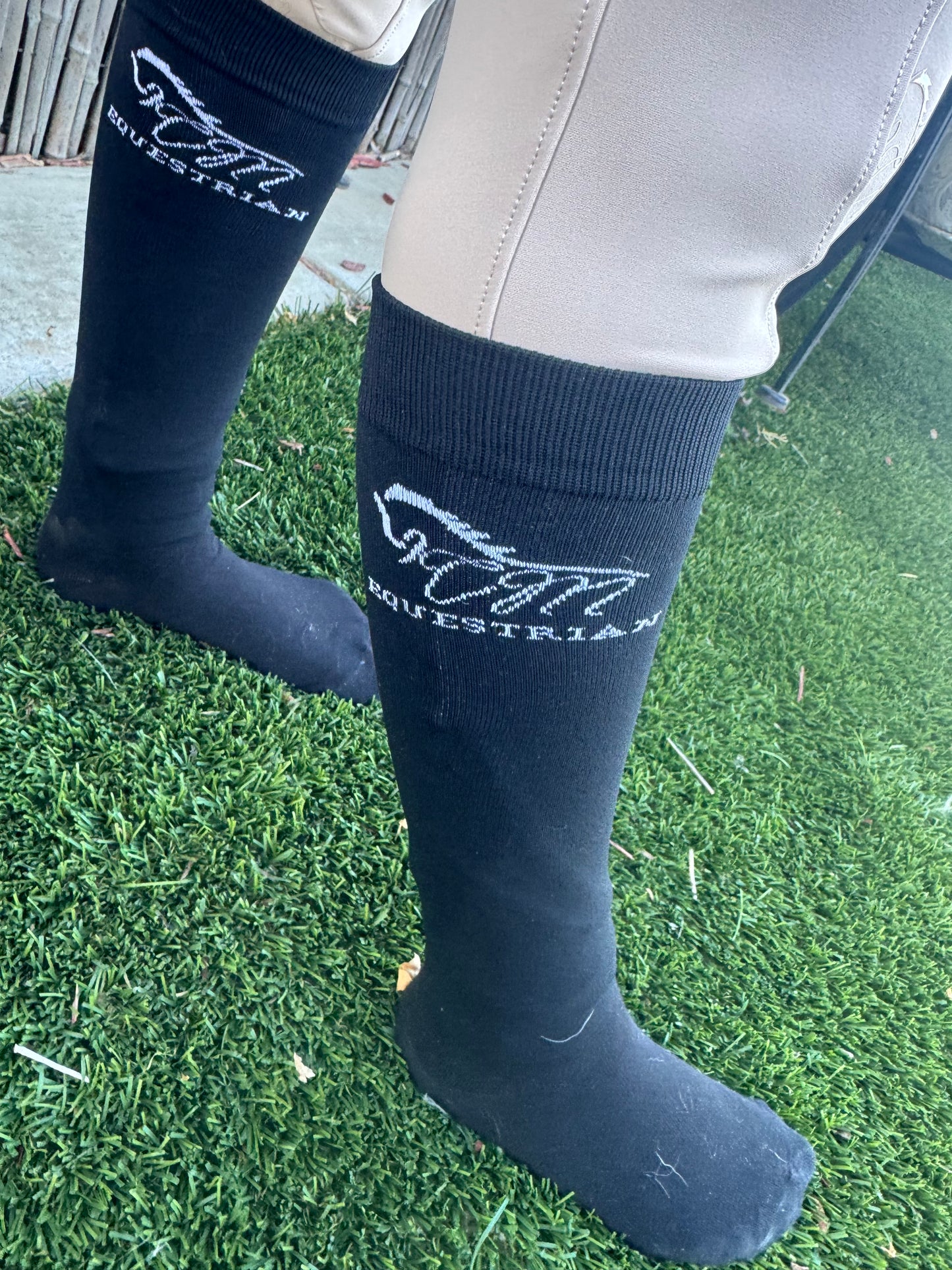 CM equestrian logo socks in black with White logo on the side.
