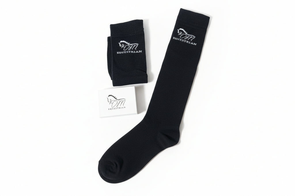 CM equestrian logo socks in black with White logo on the side.
