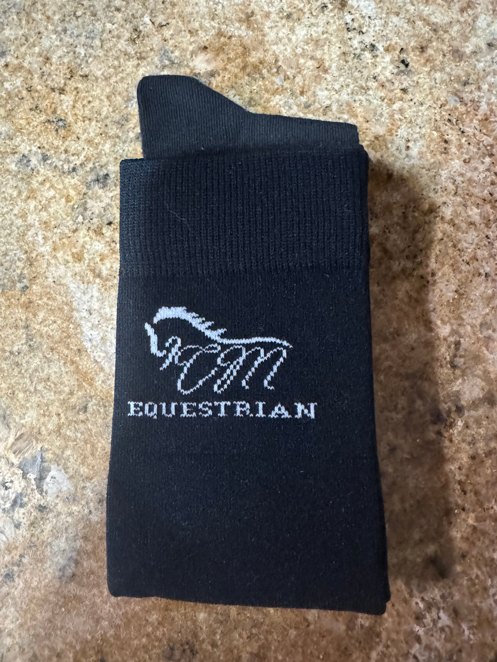 CM equestrian logo socks in black with White logo on the side.